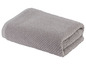 Ein graues Frotteehandtuch.