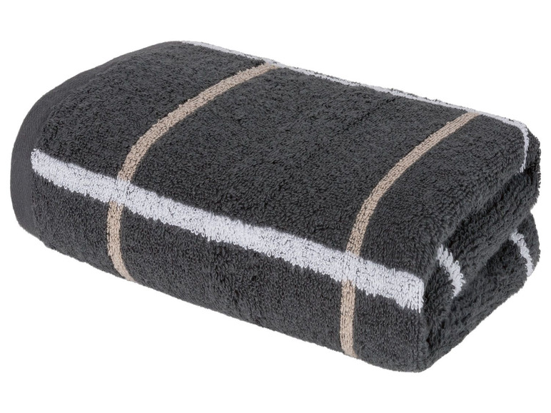 Graues Handtuch mit beige und weißen Streifen.
