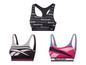 Drei Reebok Sport-BHs, darunter einer mit Logo-Druck.