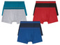 Drei Paar Boxershorts in verschiedenen Farben.