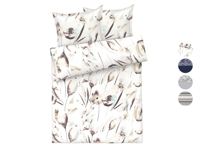 Ein weißer Bettbezug mit Blumenmuster.