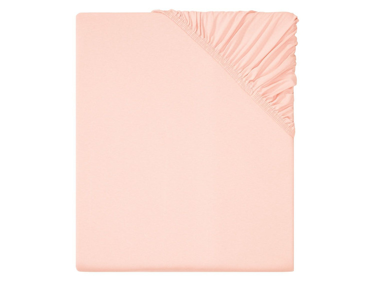 Ein rosafarbenes Spannbettlaken für ein Babybett.