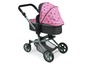 Ein rosa Puppenwagen mit Sternenmuster.