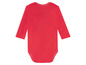 Ein roter Baby-Body mit langen Ärmeln.