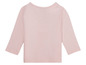 Ein rosafarbenes Langarmshirt für Babys.
