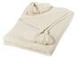 Eine cremefarbene Strickdecke mit Quasten.