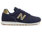 Blaue New Balance Sneaker mit goldenen Details.