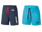 Zwei Badehosen, eine blaue mit Mistral-Logo und eine türkisfarbene mit einem M-Logo.