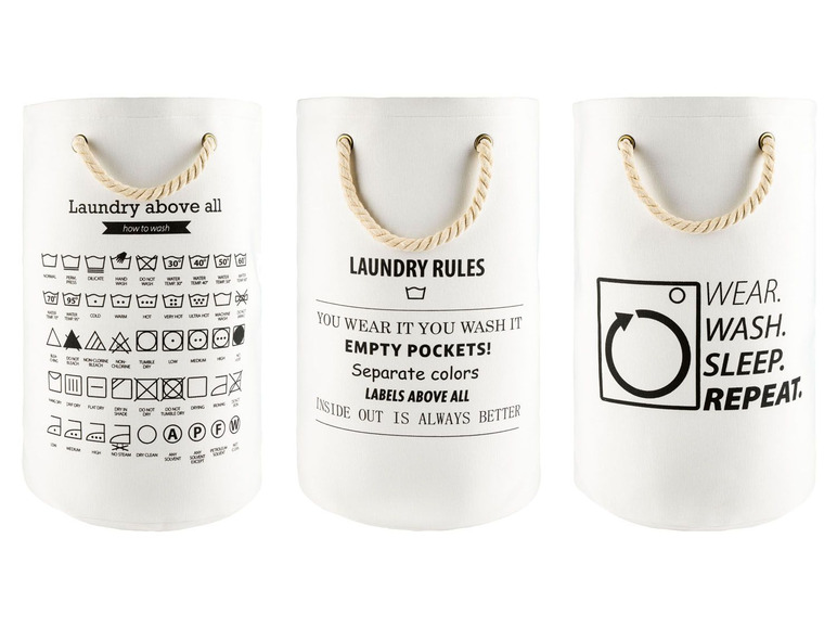 Drei weiße Wäschekörbe mit verschiedenen Texten und Symbolen, darunter Waschanleitungen und der Slogan 'Laundry above all'.
