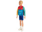Eine Barbie-Puppe mit einer bunten Jacke und blauen Shorts.