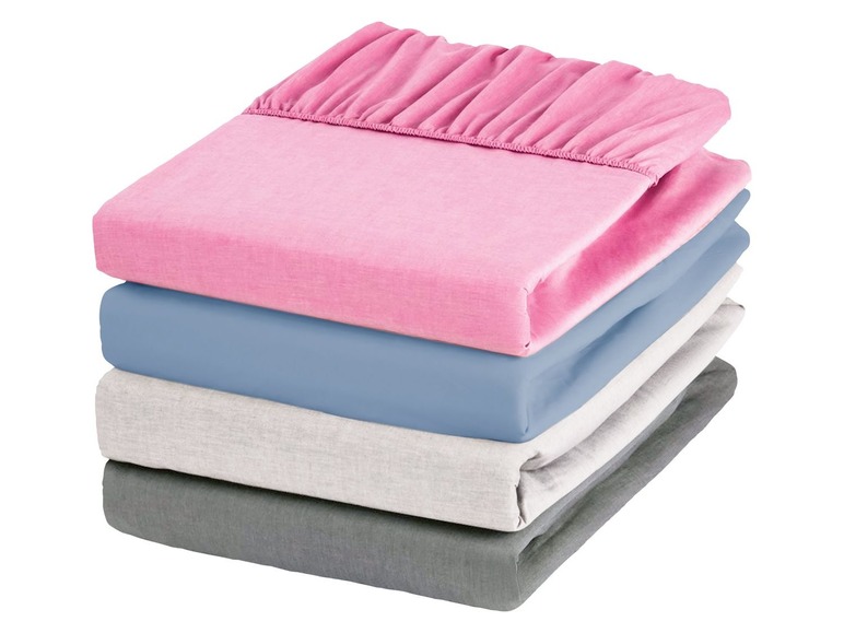 Ein Stapel Bettwäsche in rosa, blau, grau und dunkelgrau.