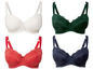 Vier verschiedene BHs in weiß, grün, rot und blau mit Spitze.