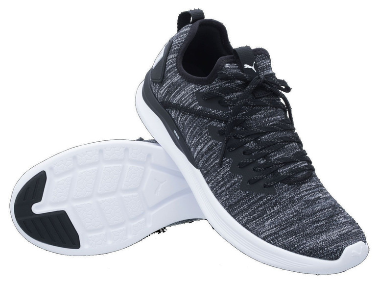 Schwarze Puma Sneaker mit weißer Sohle.