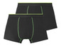Zwei schwarze Boxershorts mit grünen Details.