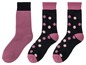 Drei Paar Socken: zwei mit rosa Punkten und ein einfarbig rosa.
