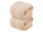 Zwei gefaltete Handtücher in Beige.