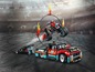 LEGO Technic Stunt-Truck mit einem Motorrad, das durch einen Reifen springt.
