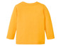 Ein gelbes Langarmshirt für Babys.