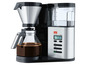 Eine Melitta Aroma Elegance Deluxe Kaffeemaschine mit Glaskanne, bereit zum Kaffeekochen.