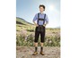 Mann in traditioneller Lederhose und blauem kariertem Hemd