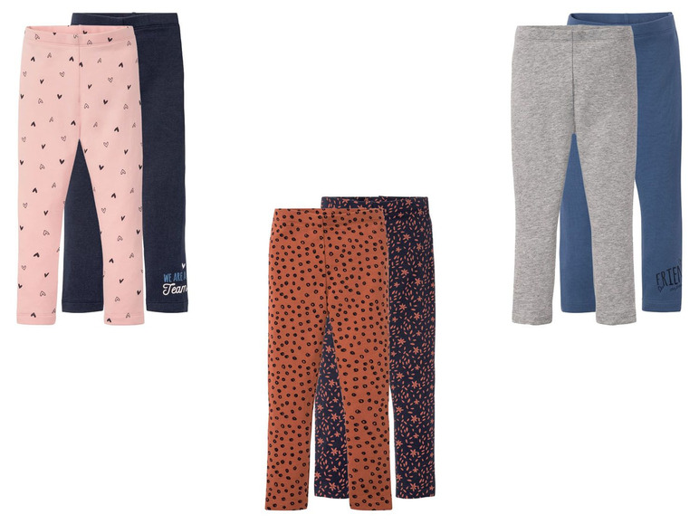 Zwei Paar Leggings mit Herz-, Punkte- und Blumenmuster.