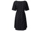 Schwarzes Kleid mit weißen Punkten.
