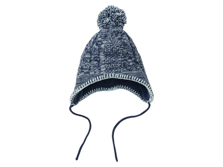 Eine blaue Strickmütze mit Bommel.