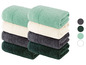 Stapel Handtücher in Mintgrün, Creme, Dunkelgrau und Dunkelgrün.