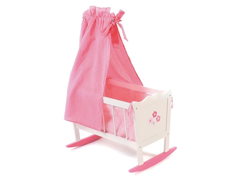 Ein rosa Wiege mit einer rosa gestreiften Matratze und rosafarbener Bettwäsche.