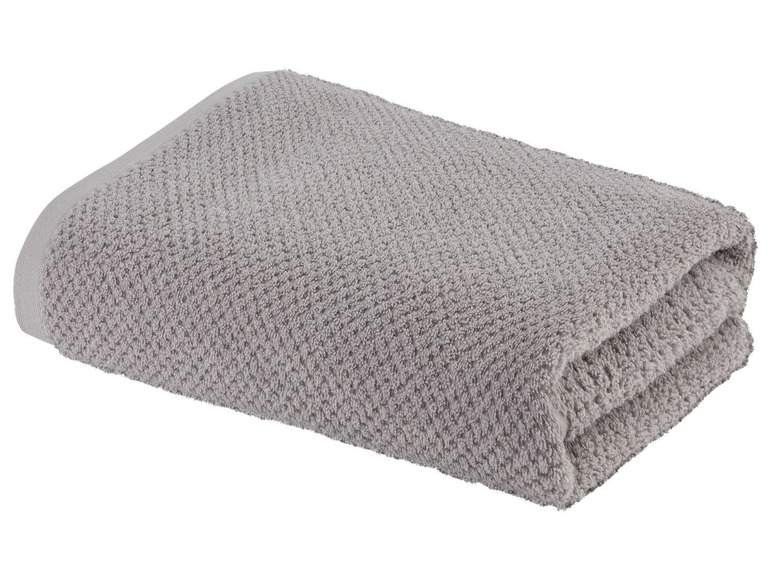 Ein graues Frotteehandtuch.