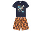 Ein blaues T-Shirt mit einem T-Rex-Skelett und orangefarbene Shorts mit Jurassic World-Logos.
