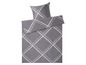 Graue Bettwäsche mit weißem Rautenmuster.