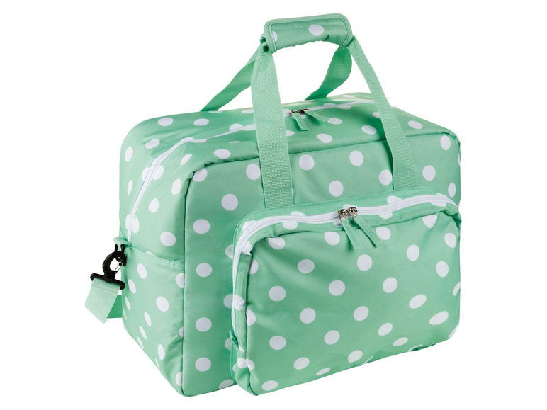 Eine mintgrüne Reisetasche mit weißen Punkten.