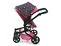 Ein rosa und schwarzer Kinderwagen mit Sternenmuster.