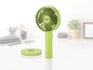 Ein grüner tragbarer Ventilator von Unoid mit einem Ladekabel.
