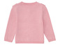 Ein rosa Pullover mit langen Ärmeln für Babys.