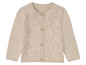 Beige gestrickte Strickjacke mit Sternenmuster für Kinder.