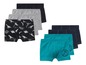 Ein Set Jungen-Boxershorts mit Dinosauriern, blauen und grünen Designs.