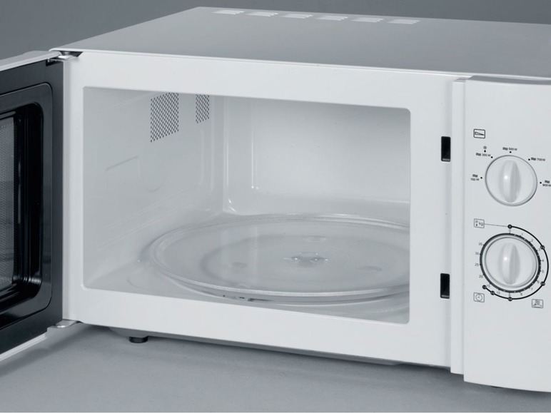 Eine weiße Mikrowelle mit Drehteller und Bedienknöpfen