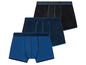 Drei Paar blaue Boxershorts.