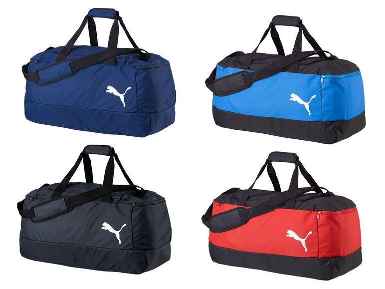 Vier Puma Sporttaschen in blau, schwarz, grau und rot.