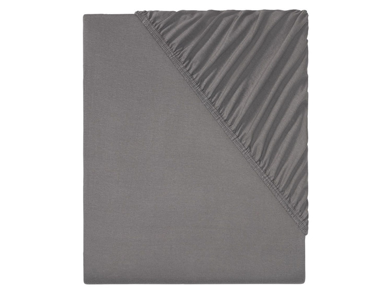 Ein graues Laken und ein Spannbettlaken.