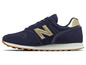 Blaue New Balance Sneaker mit goldenen Akzenten.