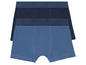 Zwei Paar blaue Boxershorts.