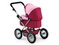 Ein rosa Kinderwagen mit rosa Verdeck.