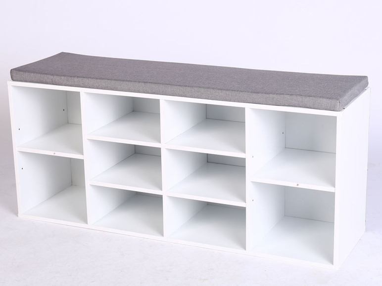 Weißer Schuhschrank mit grauer Sitzfläche.
