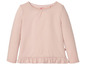 Rosa Langarmshirt mit Rüschen für Mädchen.