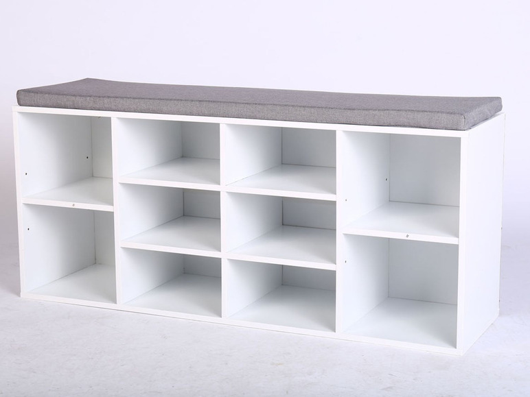 Weißer Schuhschrank mit grauer Sitzfläche.