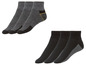 Sechs Paar Socken, drei grau und drei schwarz, mit verstärkter Ferse und Zehen.