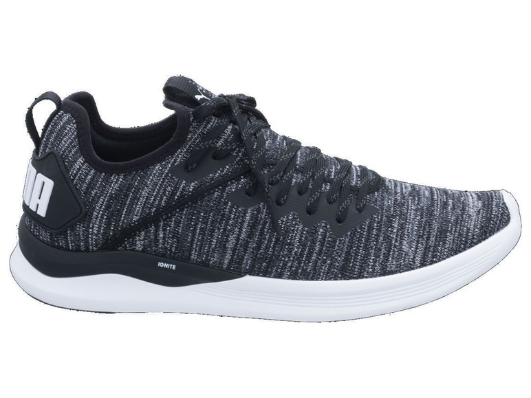 Schwarze Puma Ignite Sneaker mit grauem, gewebtem Obermaterial.